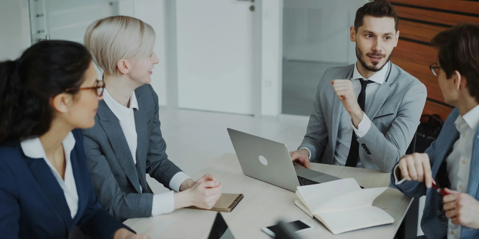 Executives discussing business priorities in a boardroom